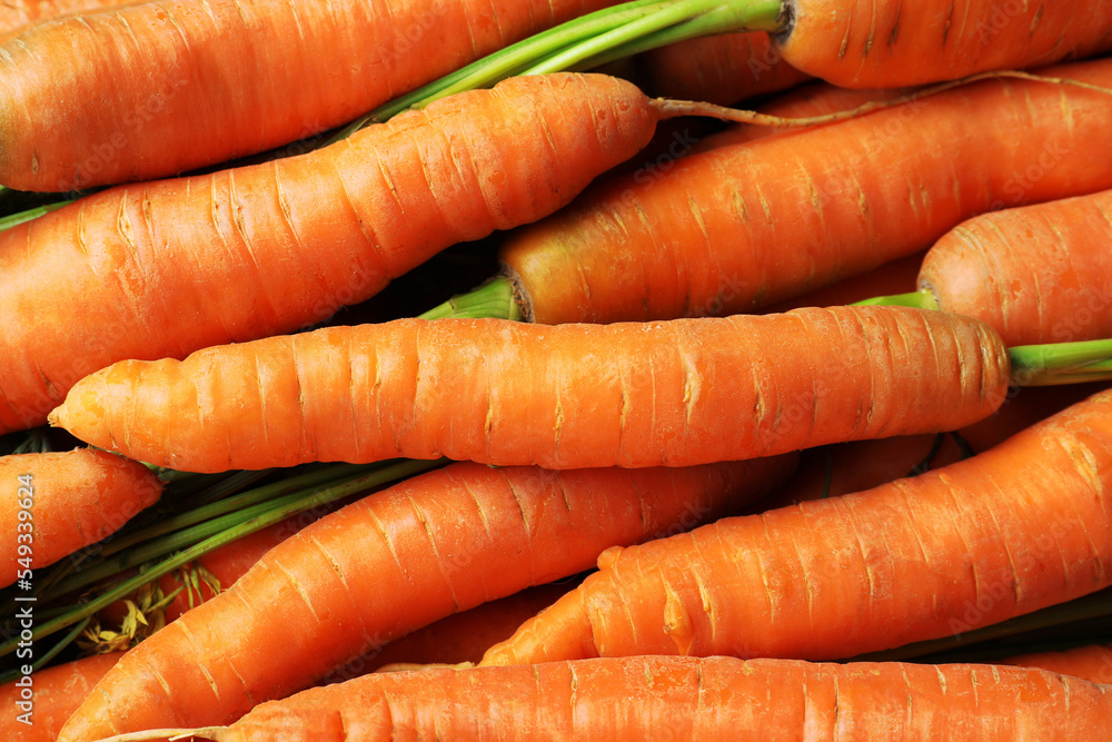 Many tasty fresh carrots as background, closeup Many tasty fresh carrots as background, closeup