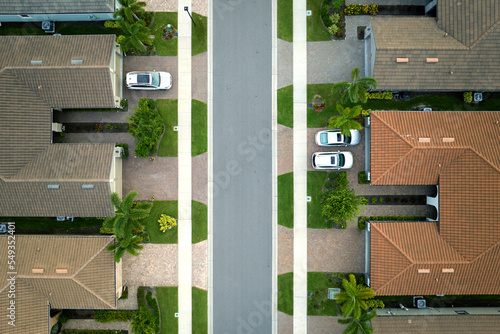 Aerial view of tightly located family houses in Florida closed suburban area. Real estate development in american suburbs