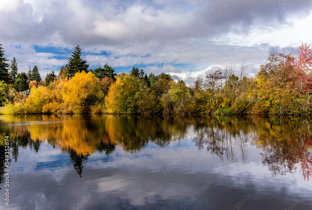 Autumn foliage reflected in lake Autumn foliage reflected in lake