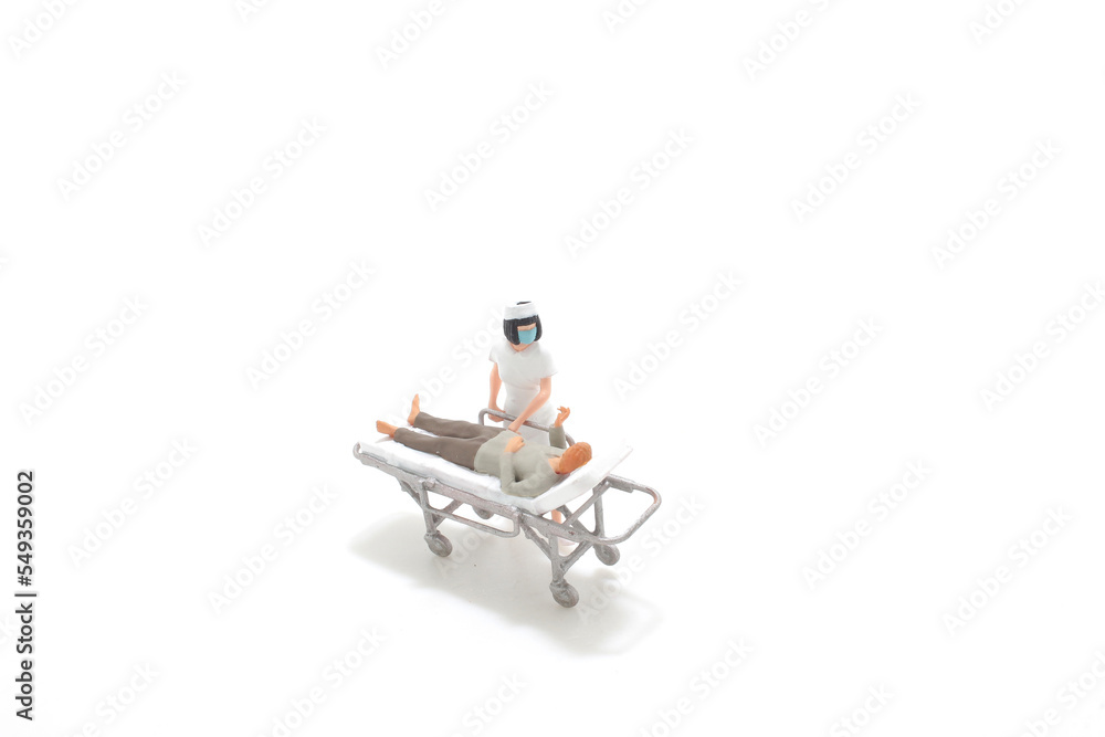 Team of medical professionals rush about for emergency in hospital corridor Team of medical professionals rush about for emergency in hospital corridor