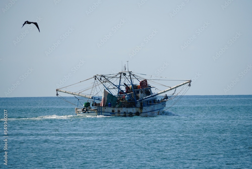 The shrimp boat moving on the ocean near Mazatlan, Mexico