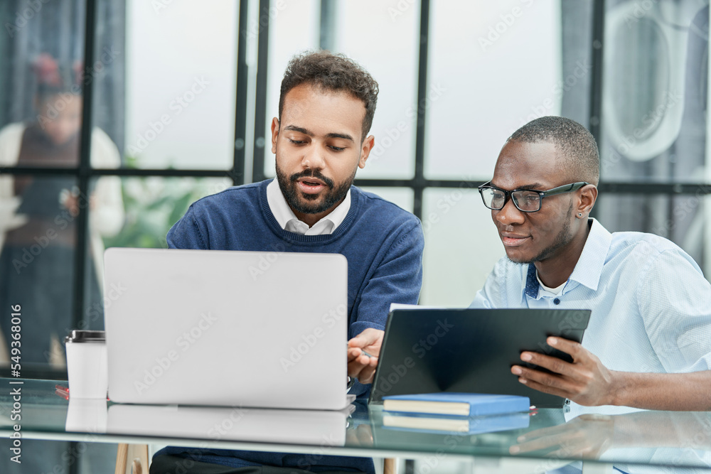 business colleagues are working with documents for a new project business colleagues are working with documents for a new project