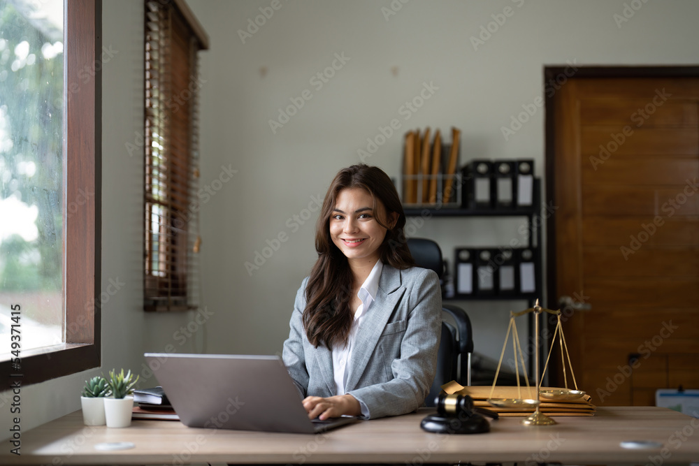 justice and law concept.Male judge in a courtroom on wooden table and Counselor or Portrait asian lawyer working with lsptop in office. Legal law, advice and justice concept justice and law concept.Male judge in a courtroom on wooden table and Counselor or Portrait asian lawyer working with lsptop in office. Legal law, advice and justice concept