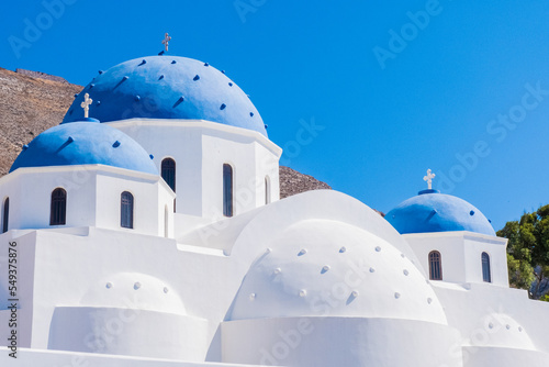Classic blue dome and white constructions of Santorini