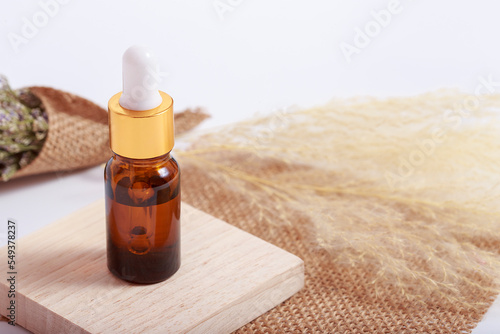 Brown bottle with cosmetic product 