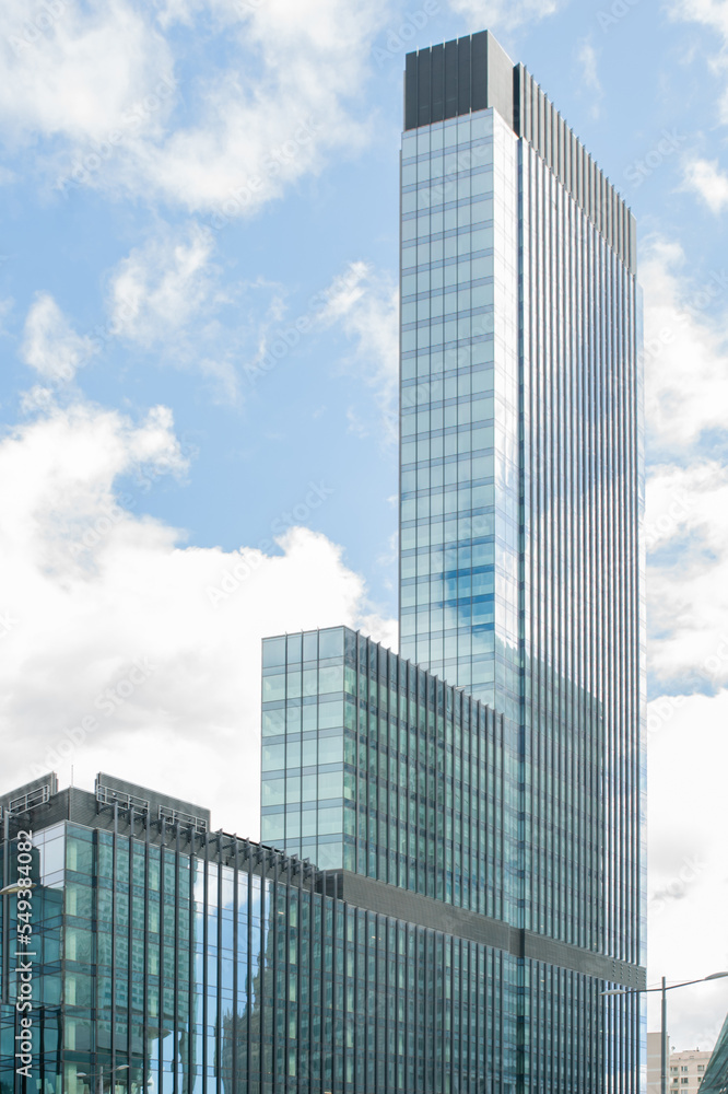 Beautiful building with many windows under cloudy sky Beautiful building with many windows under cloudy sky