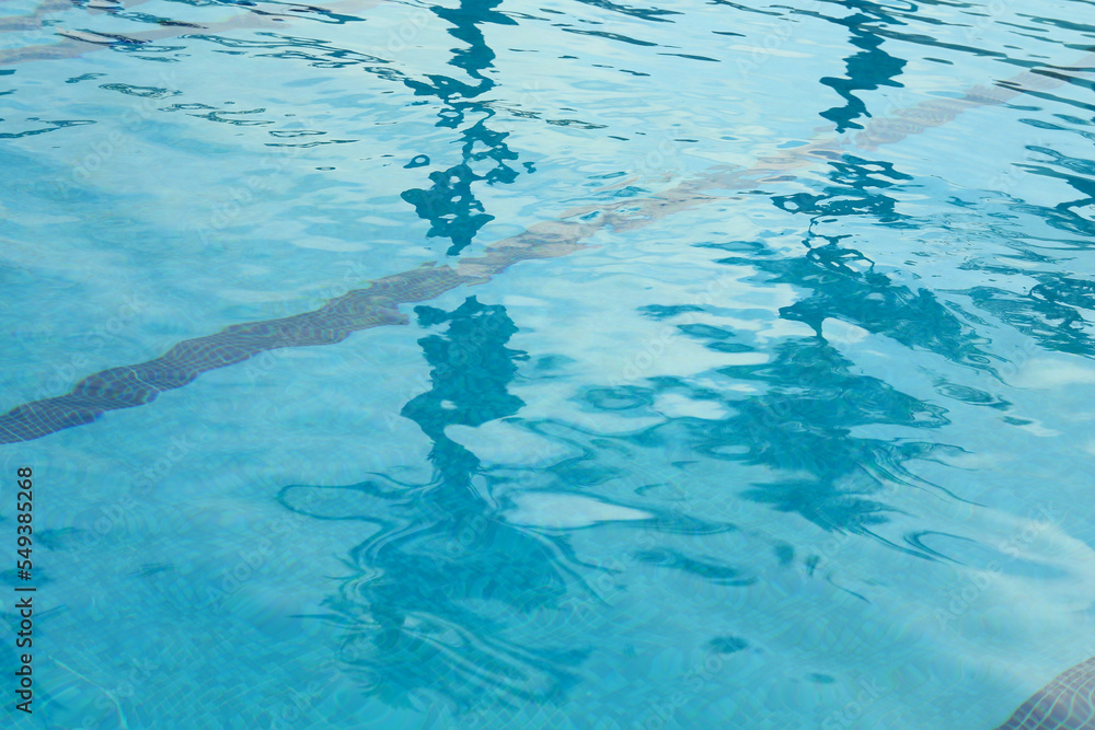Outdoor swimming pool with clear rippled water Outdoor swimming pool with clear rippled water
