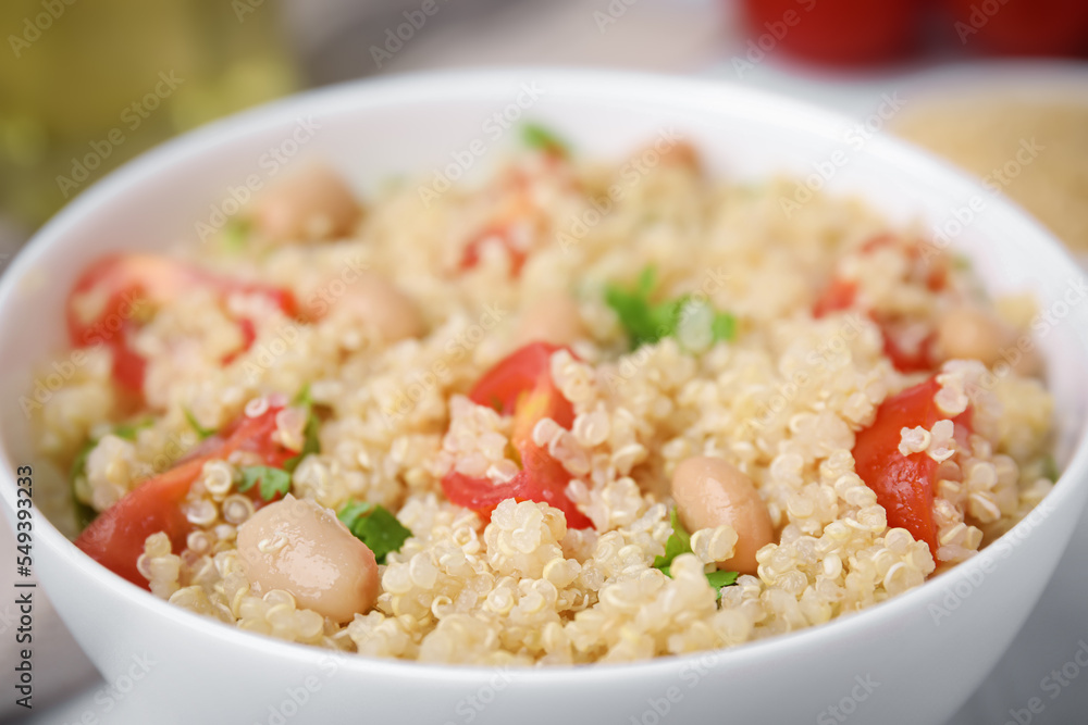 Delicious quinoa salad with tomatoes, beans and parsley, closeup Delicious quinoa salad with tomatoes, beans and parsley, closeup