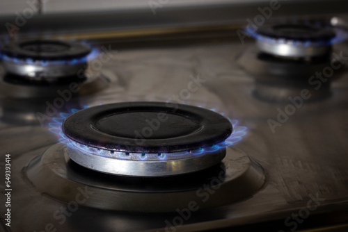burning gas burner on the stove, the concept of energy economy and utility bills