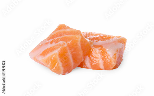 Pieces of fresh raw salmon on white background