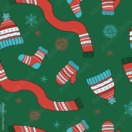 Knitwear pattern. Winter hat, scarf, mittens and socks with ornament. Vector seamless pattern. Knitting, handmade. Bright illustration , doodle style.