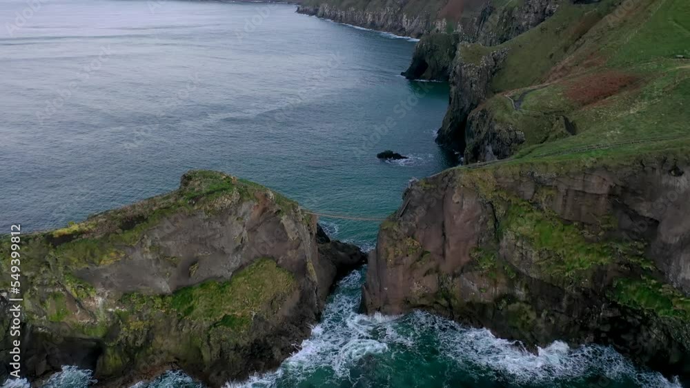 The Carrick-a-Rede Rope Bridge, near Ballintoy in County Antrim. Linking mainland the island of Carrickarede. Nothern Ireland, UK The Carrick-a-Rede Rope Bridge, near Ballintoy in County Antrim. Linking mainland the island of Carrickarede. Nothern Ireland, UK