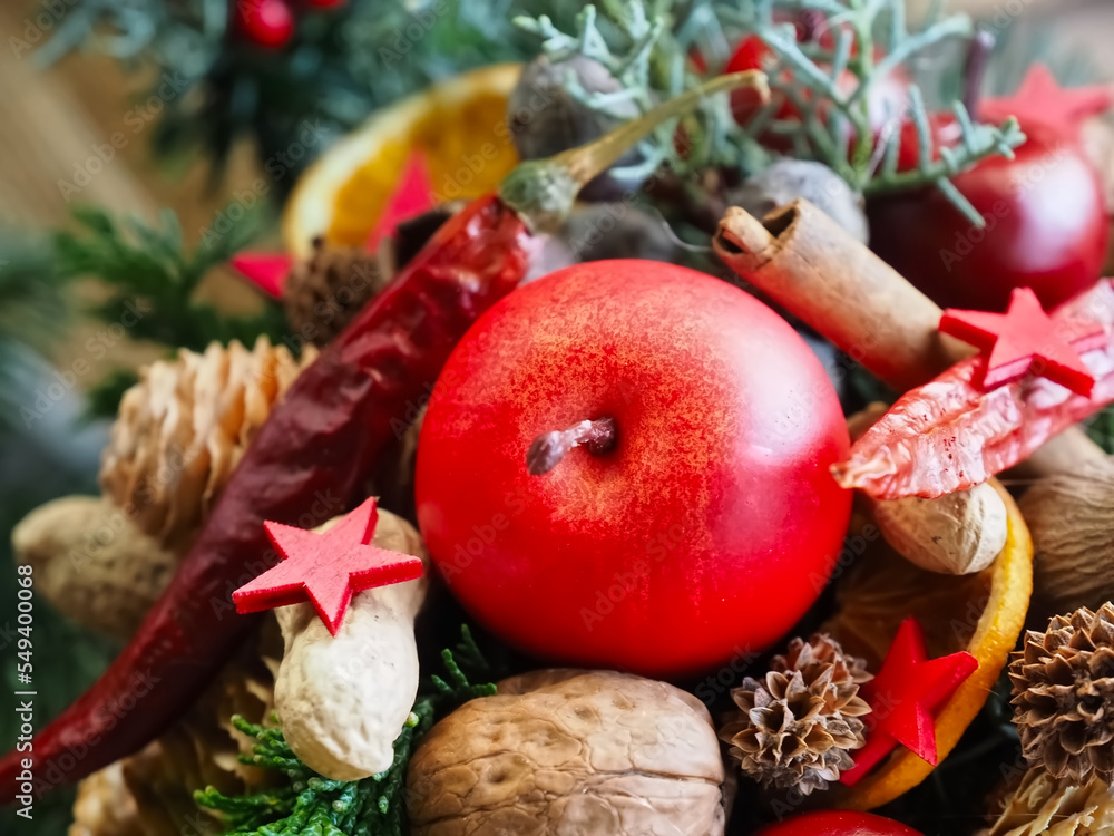 Advent or Christmas arrangement with decoration from nature apples nuts Advent or Christmas arrangement with decoration from nature apples nuts