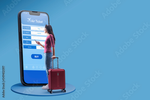 Woman booking her air ticket online photo