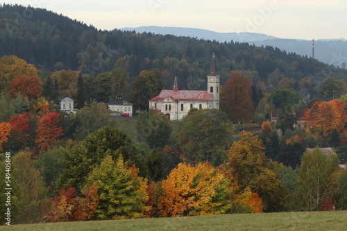 autumn landscape in the mountains with old church
