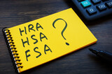 Notepad with notes HRA, HSA, FSA and question mark.