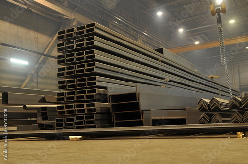 Warehousing in the workshop at the plant stock of metal I-beams profile pipes, channels.