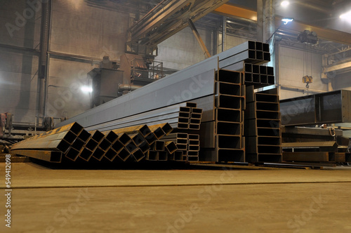 Warehousing in the workshop at the plant stock of metal I-beams profile pipes, channels.