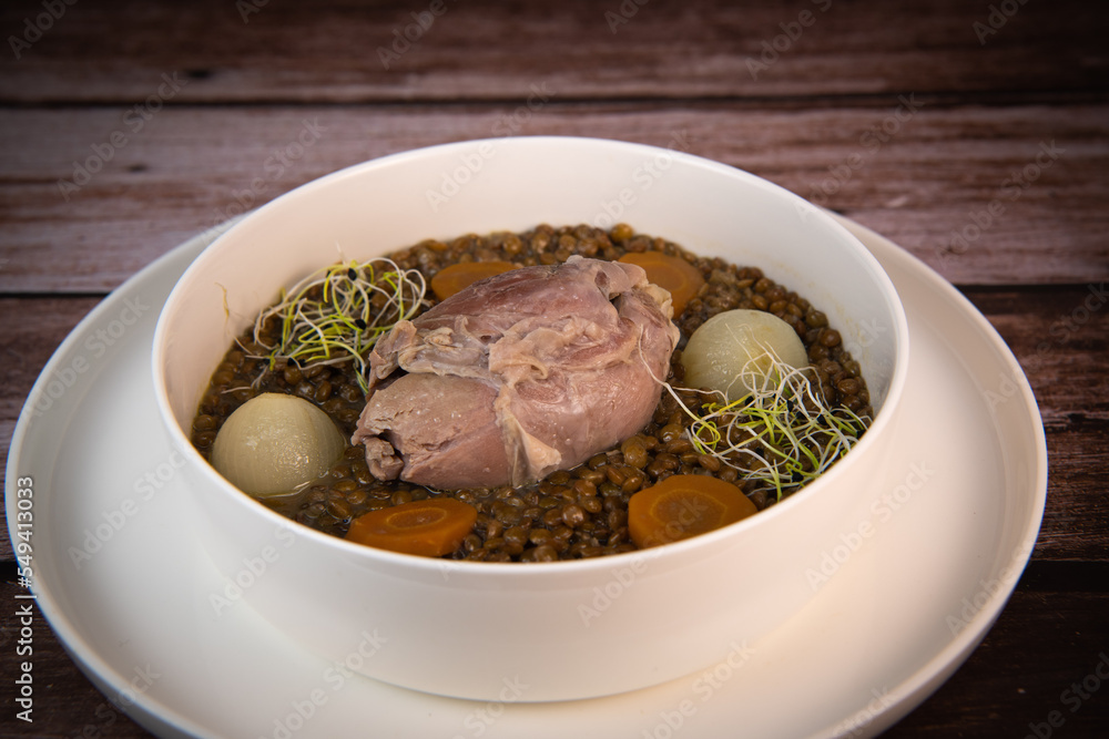 Recipe for salted pork shank with lentils. High quality photo