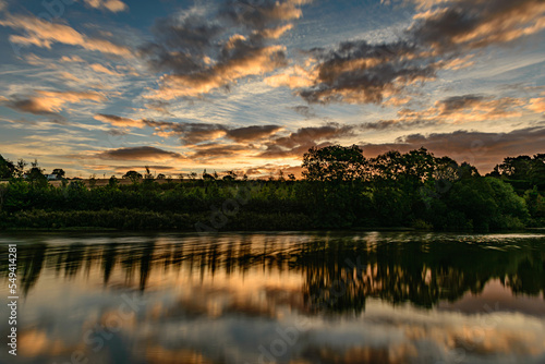 Fototapeta Naklejka Na Ścianę i Meble -  sunset over lake Ulley Country Park