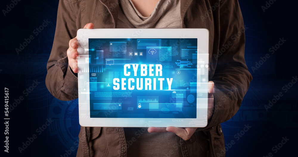 Person holding tablet, security concept Person holding tablet, security concept