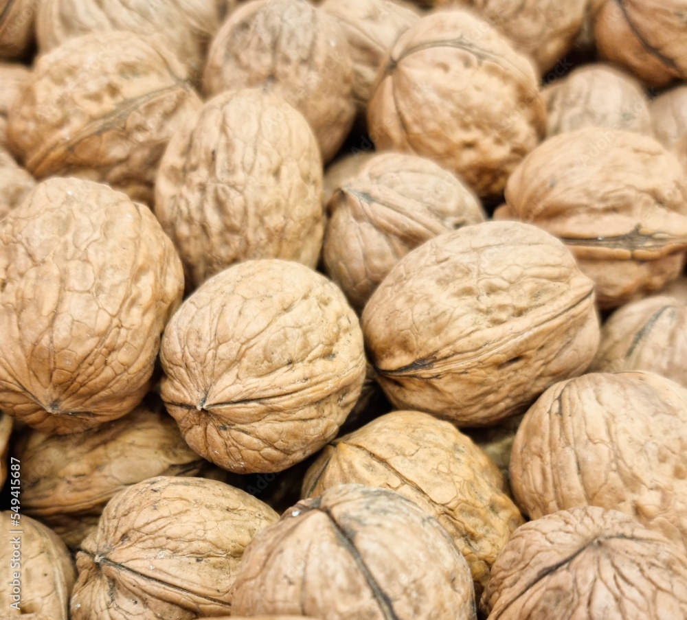Fondo con detalle y textura de varias nueces con tonos marrones Fondo con detalle y textura de varias nueces con tonos marrones