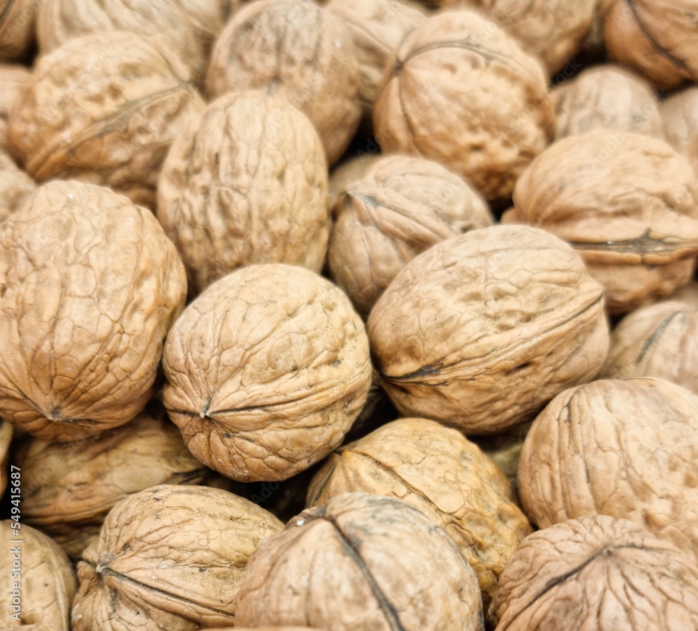 Fondo con detalle y textura de varias nueces con tonos marrones