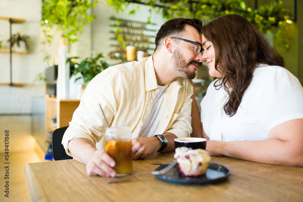 Happy boyfriend and girlfriend on a coffee date