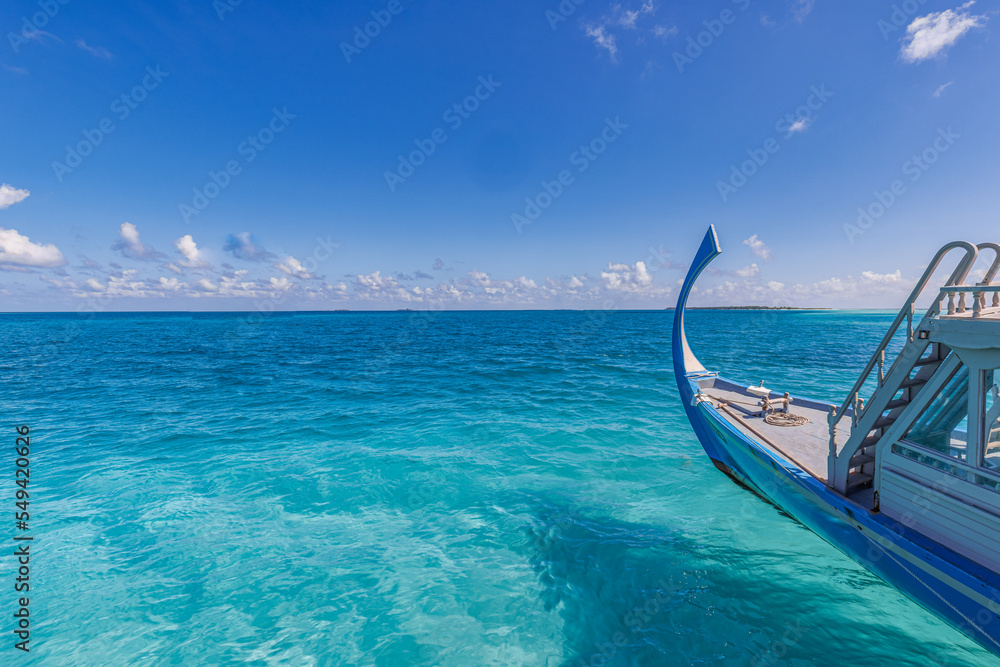 Inspirational Maldives beach design. Maldives traditional sail boat Dhoni and perfect blue sea with lagoon. Luxury tropical resort hotel paradise view. Idyllic ocean bay. Exotic travel background