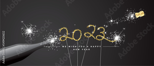 We wish you Happy New Year 2023 eve handwritten tipography golden glitter stars sparkler fireworks open champagne bottle black background greeting card