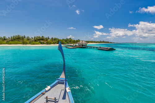 Fototapeta Naklejka Na Ścianę i Meble -  Inspirational Maldives beach design. Maldives traditional sail boat Dhoni and perfect blue sea with lagoon. Luxury tropical resort hotel paradise view. Idyllic ocean bay. Exotic travel background