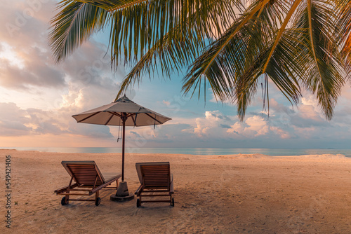 Fototapeta Naklejka Na Ścianę i Meble -  Fantastic beach. Couple chairs sandy beach sea. Luxury summer holiday and vacation resort hotel for tourism. Inspirational tropical landscape. Tranquil scenery, relax beach, beautiful landscape design