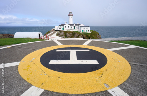 Fanad Head Lighthouse with its rough cliffs in the northern part of Republik of Ireland photo