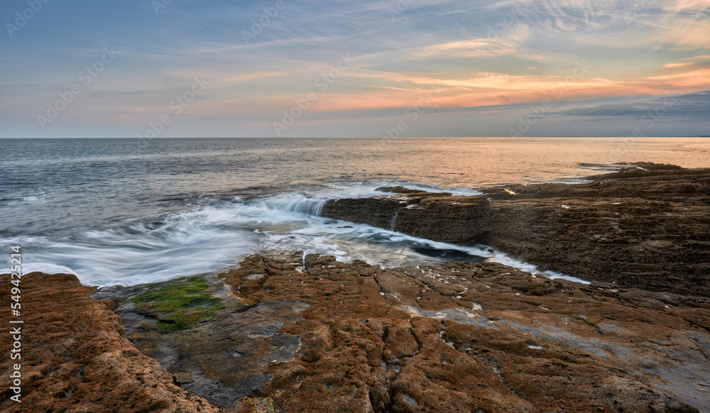 rocky coastline at sunset in southern Republic of Ireland near Annestown rocky coastline at sunset in southern Republic of Ireland near Annestown