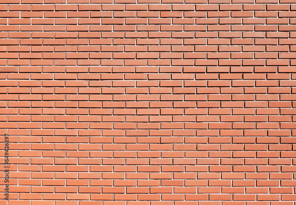 Red brick wall texture. Simple block background. Grunge pattern. Building structure backdrop.