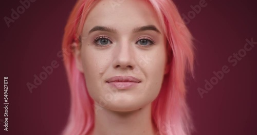Wallpaper Mural Young woman with dyed pink hair looks in camera smiling Torontodigital.ca