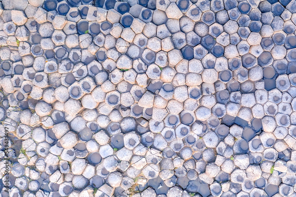 Aerial view with dozen of stones on Giants Causeway, the famous landmark on Northern Ireland UK Aerial view with dozen of stones on Giants Causeway, the famous landmark on Northern Ireland UK