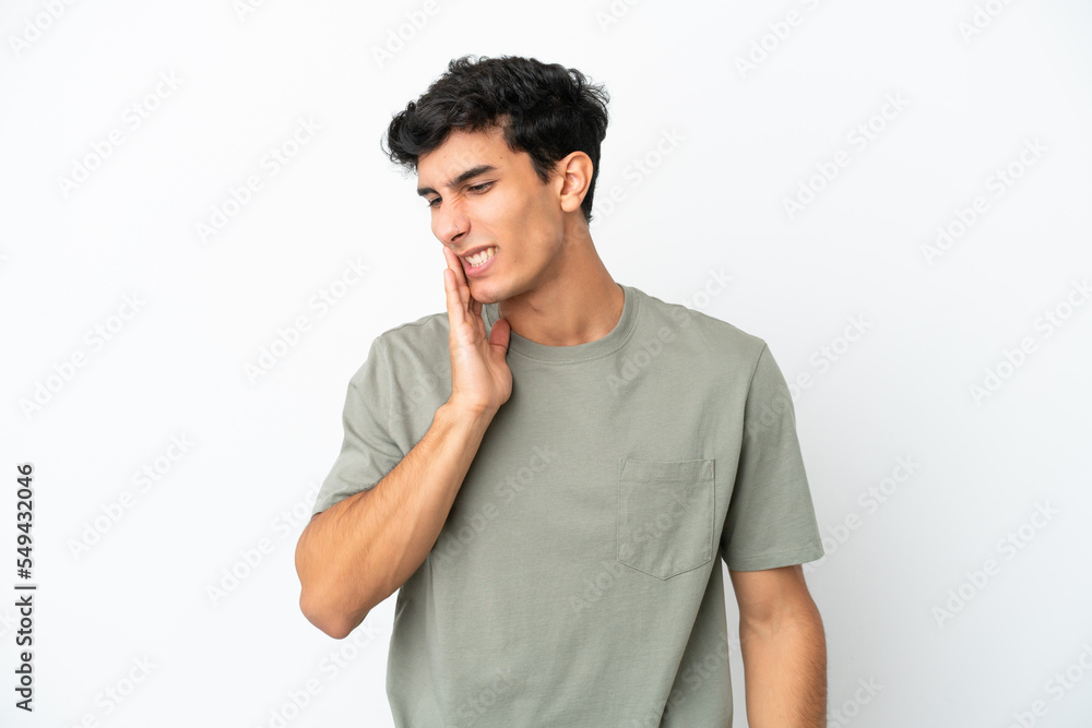 Young Argentinian man isolated on white background with toothache Young Argentinian man isolated on white background with toothache