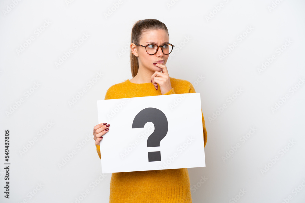 Young caucasian woman isolated on white background holding a placard with question mark symbol and thinking Young caucasian woman isolated on white background holding a placard with question mark symbol and thinking