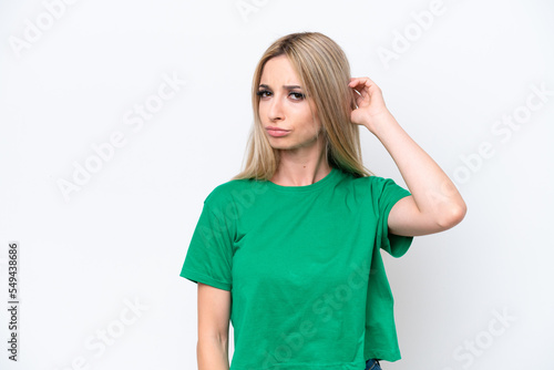 Pretty blonde woman isolated on white background having doubts