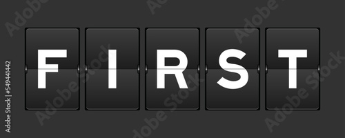 Black color analog flip board with word first on gray background