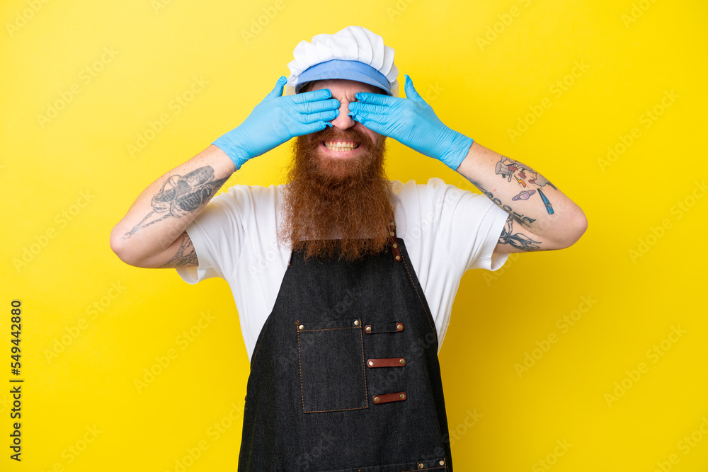 Fishmonger wearing an apron isolated on yellow background covering eyes by hands Fishmonger wearing an apron isolated on yellow background covering eyes by hands