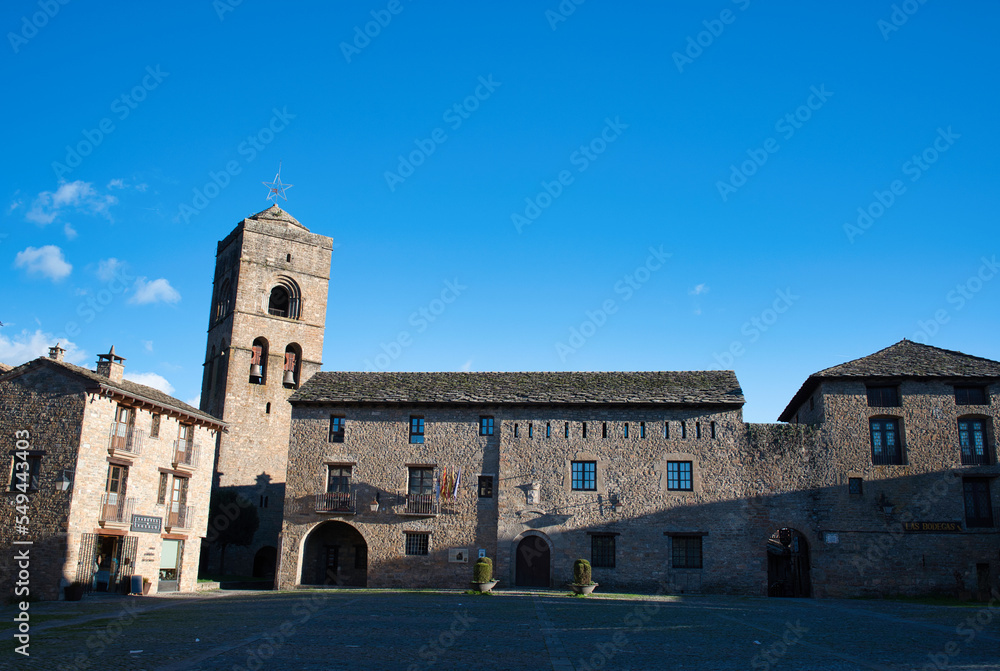 View of the Plaza Mayor and the church of Santa Maria in the medieval village of Ainsa Sobrarbe, in the Spanish Pyrenees.