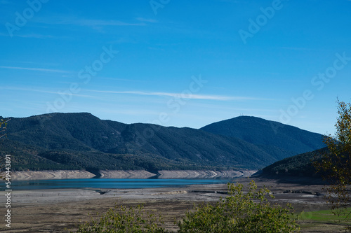 Drought in Spain. Effects of climate change such as desertification and droughts. El Mediano reservoir with little water. Huesca. Spain. November 2022.