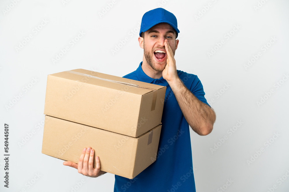 Delivery man over isolated white background shouting with mouth wide open Delivery man over isolated white background shouting with mouth wide open