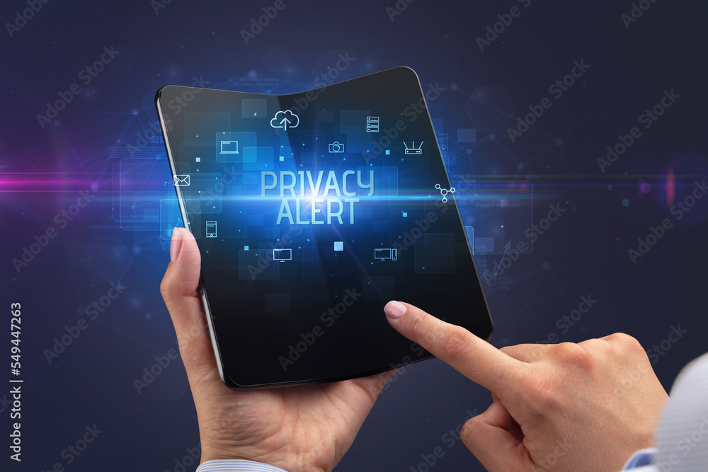 Businessman holding a foldable smartphone, security concept Businessman holding a foldable smartphone, security concept