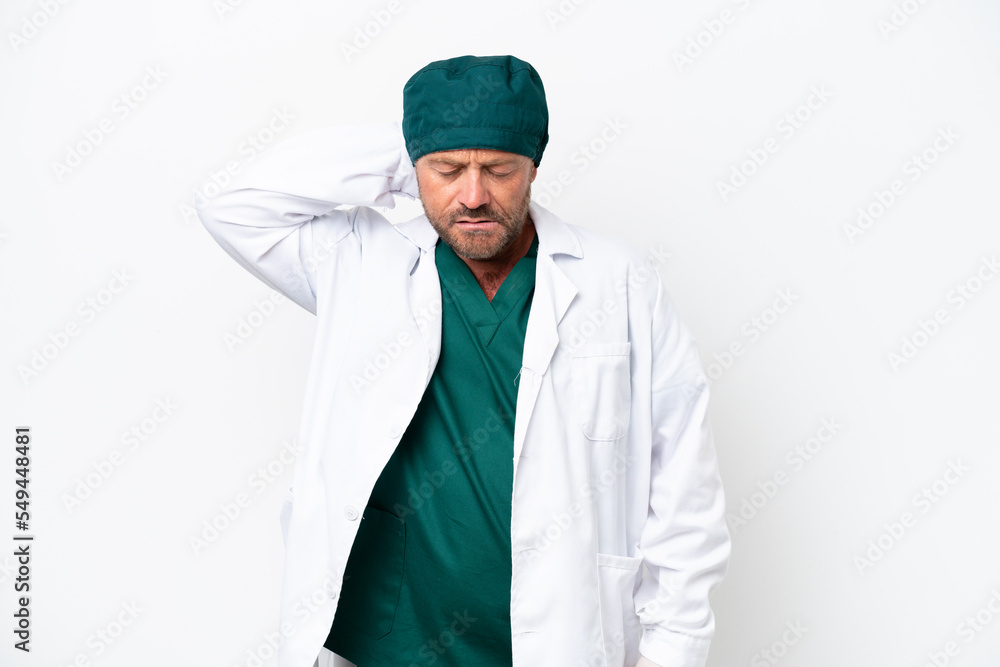 Middle age surgeon in green uniform isolated on white background with neckache Middle age surgeon in green uniform isolated on white background with neckache
