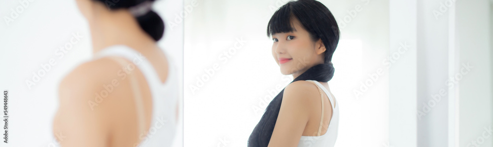 Beautiful young asian woman looking body in mirror with belly figure slim at home, beauty girl shape fit with weight loss, abdomen and waist sexy perfect, weightloss and diet, lifestyles concept. Beautiful young asian woman looking body in mirror with belly figure slim at home, beauty girl shape fit with weight loss, abdomen and waist sexy perfect, weightloss and diet, lifestyles concept.