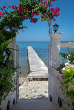 White wooden pier on the greek island Corfu . Greece