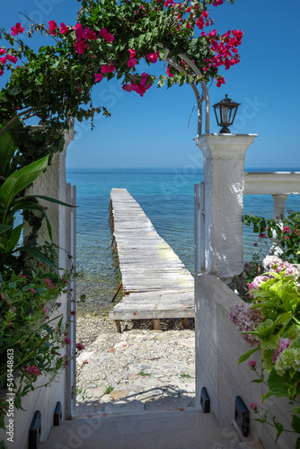 White wooden pier on the greek island Corfu . Greece